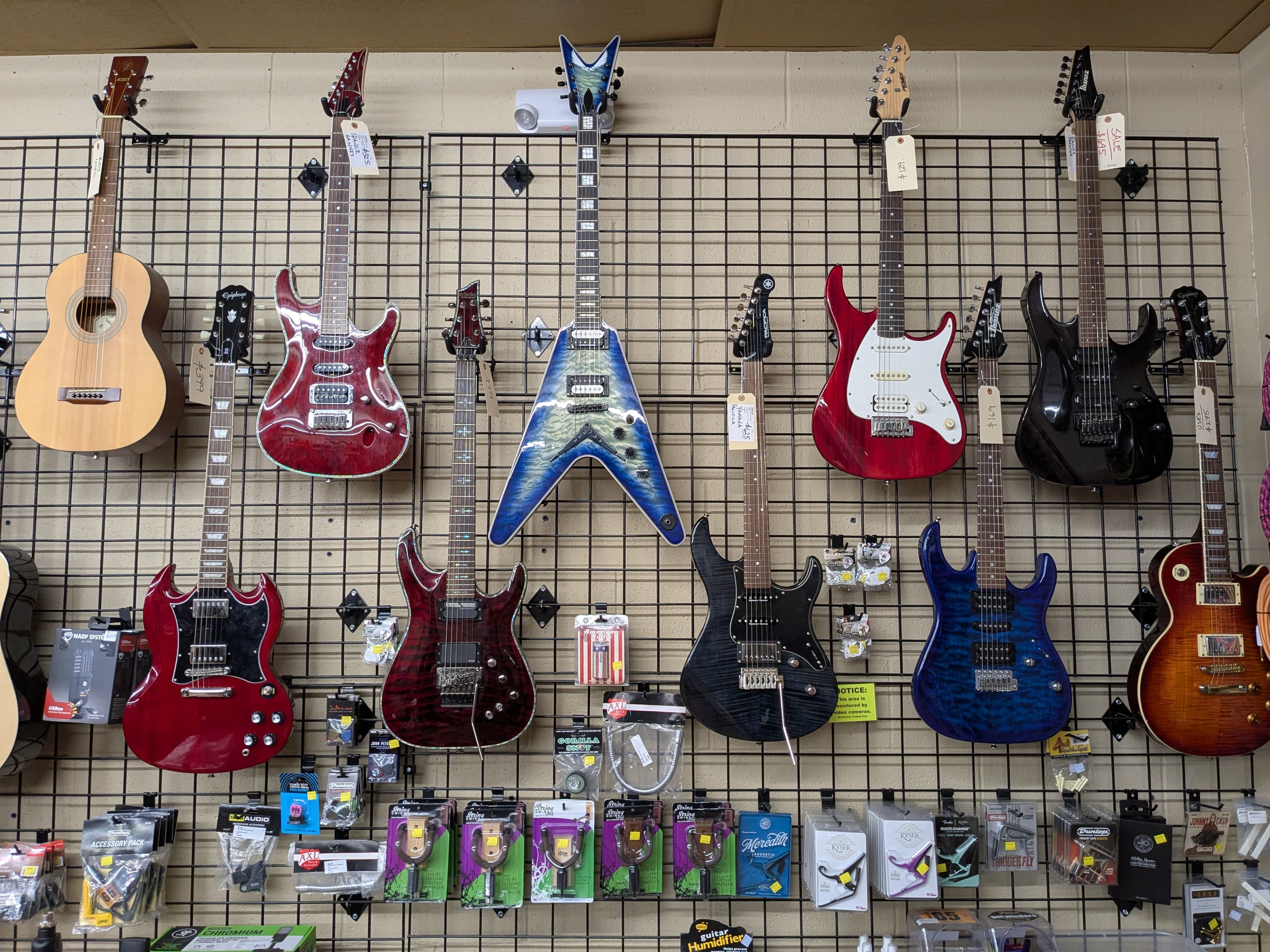 Electric guitars on wall display