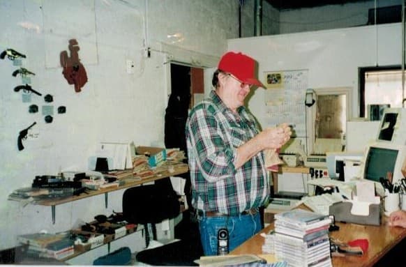 Jim working behind the counter at Northwest Trading Post on South Clark Street